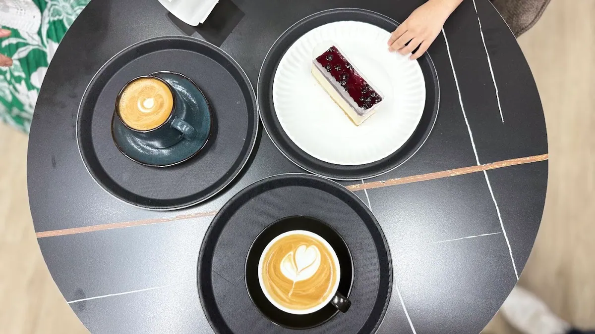 Blueberry cheesecake, cappuccino and espresso